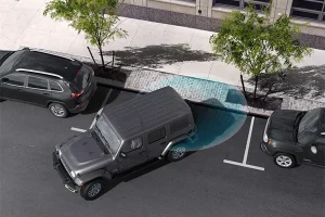 An overhead view of a Jeep Wrangler parking with driver assistance technology